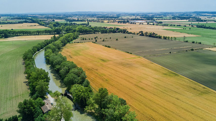 Fototapeta na wymiar Aerial top view of Canal du Midi and vineyards from above, beautiful rural countryside landscape of Southern France 