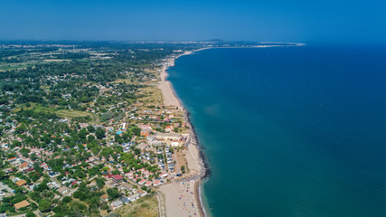 Aerial top view of sandy beach of Mediterranean sea from above, vacation concept

