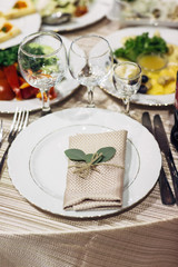 Green leaves lie on the plate