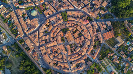 Aerial top view of Bram medieval village architecture and roofs from above, Southern France
