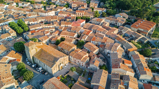 Aerial top view of Bram medieval village architecture and roofs from above, Southern France
