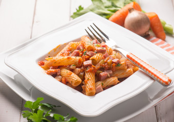 pasta with tomatoes sauce and bacon, selective focus