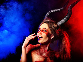 Mad satan woman on black magic ritual of in hell . Witch reincarnation mythical creature on...