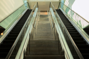 Staircase between escalator.