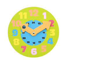 10.10 (ten past ten) O'clock round toy clock isolated on white background. with copy space.