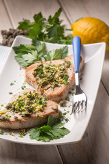 grilled tuna with caper and lemon peel, selective focus