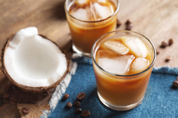 Glasses of cold tasty coconut coffee on table