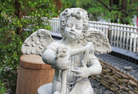 Cupids statue in public park.