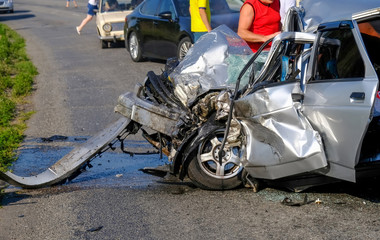 Damaged vehicle closeup after car crash. A terrible accident.