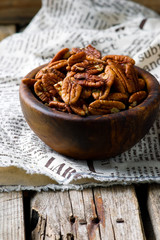 a pecan is in a wooden bowl. style rustic
