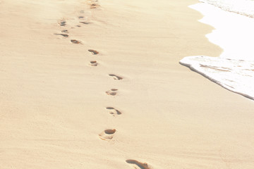 Human footprints on beach sand at resort