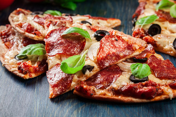 Slices of pizza pepperoni with olives