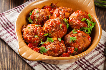 Pork meatballs with spicy tomato sauce in dish