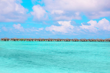 Modern beach houses on piles at tropical resort