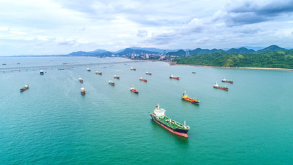 Naklejka na ściany i meble oil tanker, gas tanker in the high sea.Refinery Industry cargo ship. top view,aerial view,Thailand, in import export, LPG,oil refinery, Logistics and transportation with working crane bridge in harbor