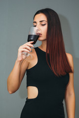 Beautiful girl with a glass of wine