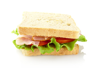 Sandwich with lettuce,tomato,cold cuts on white-bird's eye view