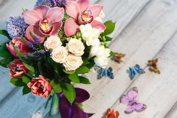 Bouquet of Tulips, roses, wildflowers wooden table, spase for text