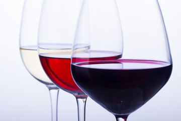 Set of three wine glasses with red, white and rose wine