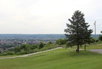 A view of a small town from a hilltop park.