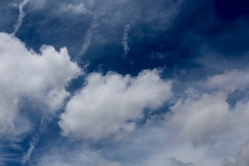 The white clouds in the blue sky.