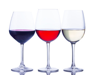 Set of three wine glasses with red, white and rose wine isolated on white background
