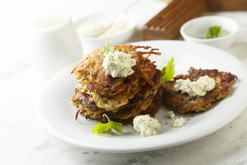 Potato latkes with cream cheese and herbs