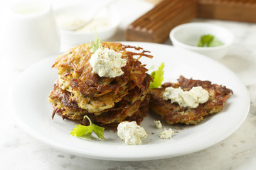 Potato latkes with cream cheese and herbs