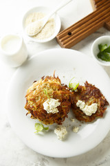 Potato latkes with cream cheese and herbs