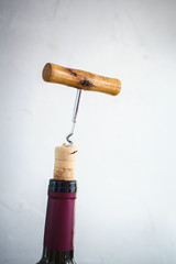 Bottle Wine with Corkscrew Grey Background