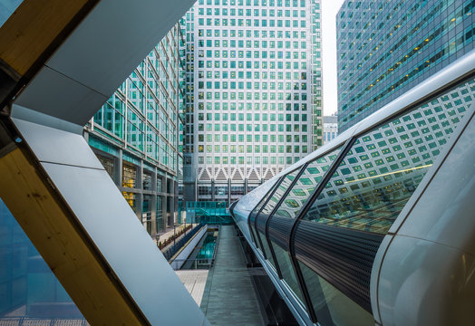 London, England - Public pedestrian cross rail footbridge at the financial district of Canary Wharf with skyscrapers