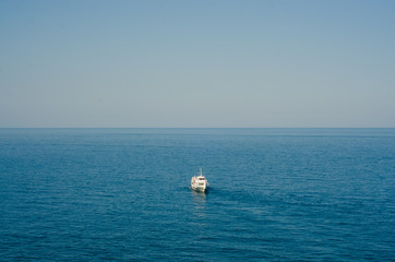Ship in the blue sea sky