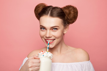 Woman holding cup of milkshake - Powered by Adobe