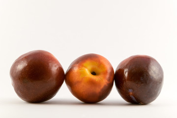 Fototapeta na wymiar organic red and yellow plums.