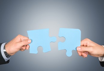 Hands and puzzle.