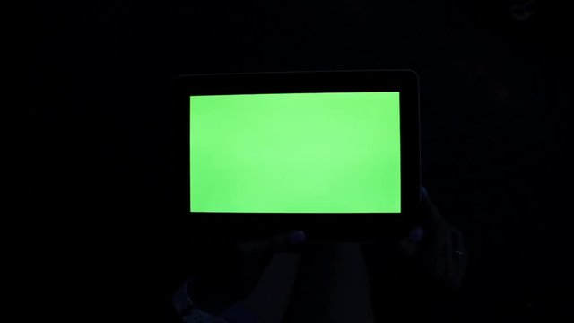 A tablet with a green screen. Tablet computer with a green screen.