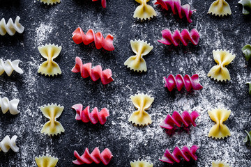 various kinds of paste on dark background top view