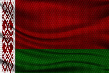 National flag of Belarus on wavy fabric with a volumetric pattern of hexagons. Vector illustration.