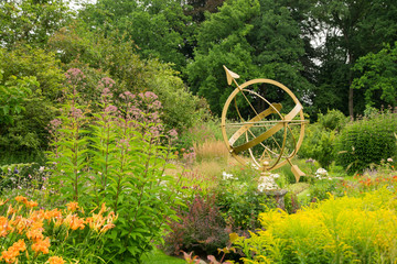 Sundial in the midst of the flowers of the castle grounds