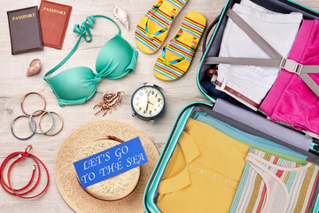 Summer vacation background, grey surface. Family resort abroad with beautiful accessories.