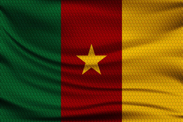National flag of Cameroon on wavy fabric with a volumetric pattern of hexagons. Vector illustration.