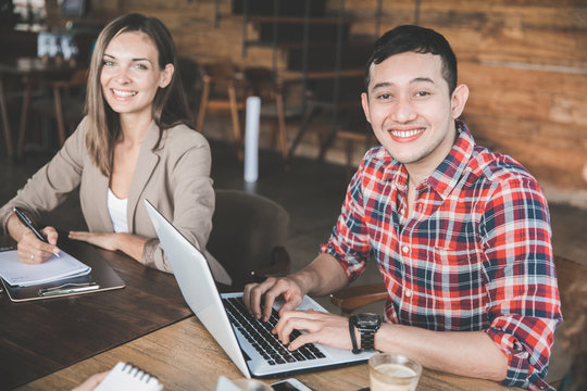 two young partner sitting together