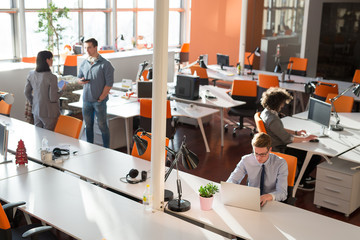 Two Business People Working With laptop in office