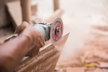 cutting a tile using an angle grinder
