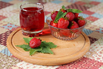 Fresh strawberries and glass of strawberry drink.
