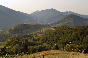 A path leading across the mountains to a small mountain village