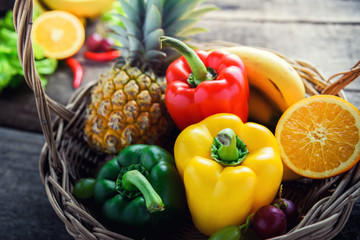 Fototapeta na wymiar fresh vegetables and fruits for fitness dinner on wooden background, food concept