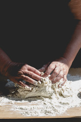 Grand mother kneading pastry for Christmas baking