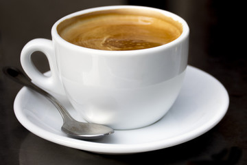 Hot cup of coffee and milk 