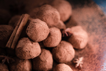 Homemade Healthy Vegan Chocolate Truffles with Dates, Avocado, Cocoa Powder, Cinnamon and Anise on Dark Background, Close-up Top Horizontal View, Amazing Food Wallpaper